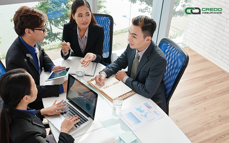 Corporate workers engaged in a business meeting