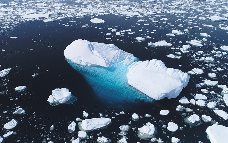 Melting icebergs in the ocean illustrating global climate change.