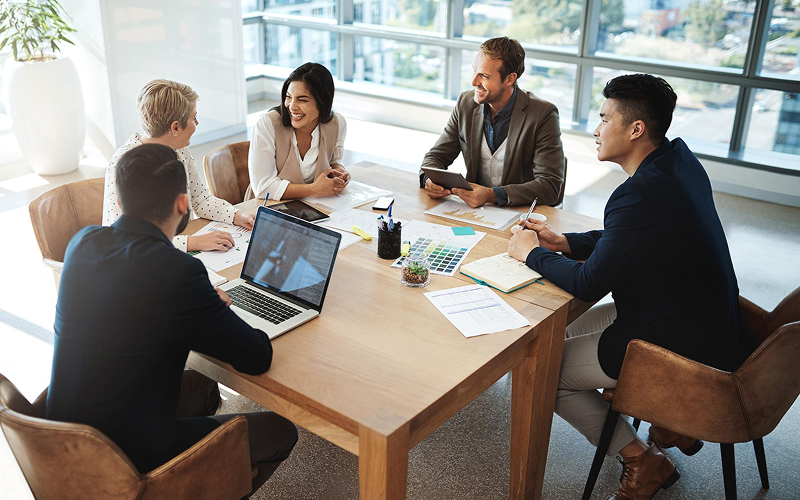 Corporate team meeting to discuss sustainable business strategy.