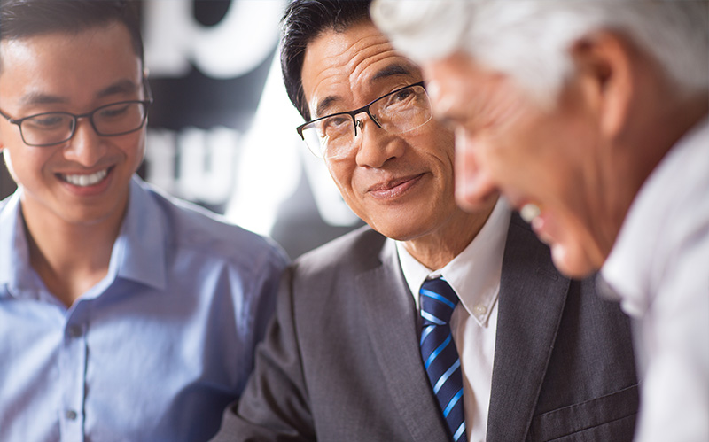 Business leaders discussing reports.