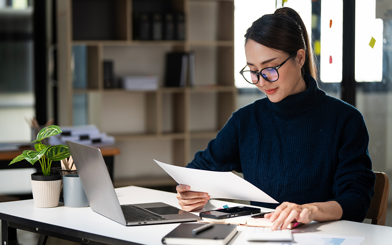 Chartered accountant reviewing compliance data for corporate ESG reporting